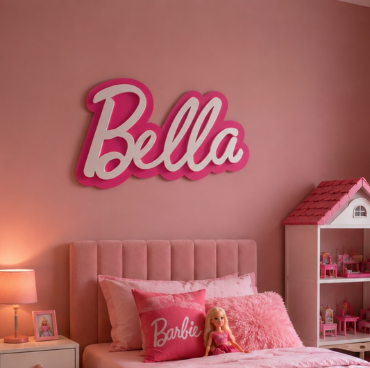 Pink bedroom with 'Bella' sign on wall, bed with Barbie-themed decor, and dollhouse.